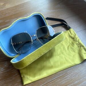 Gucci Sunglasses with Gold Frame and Black Lenses